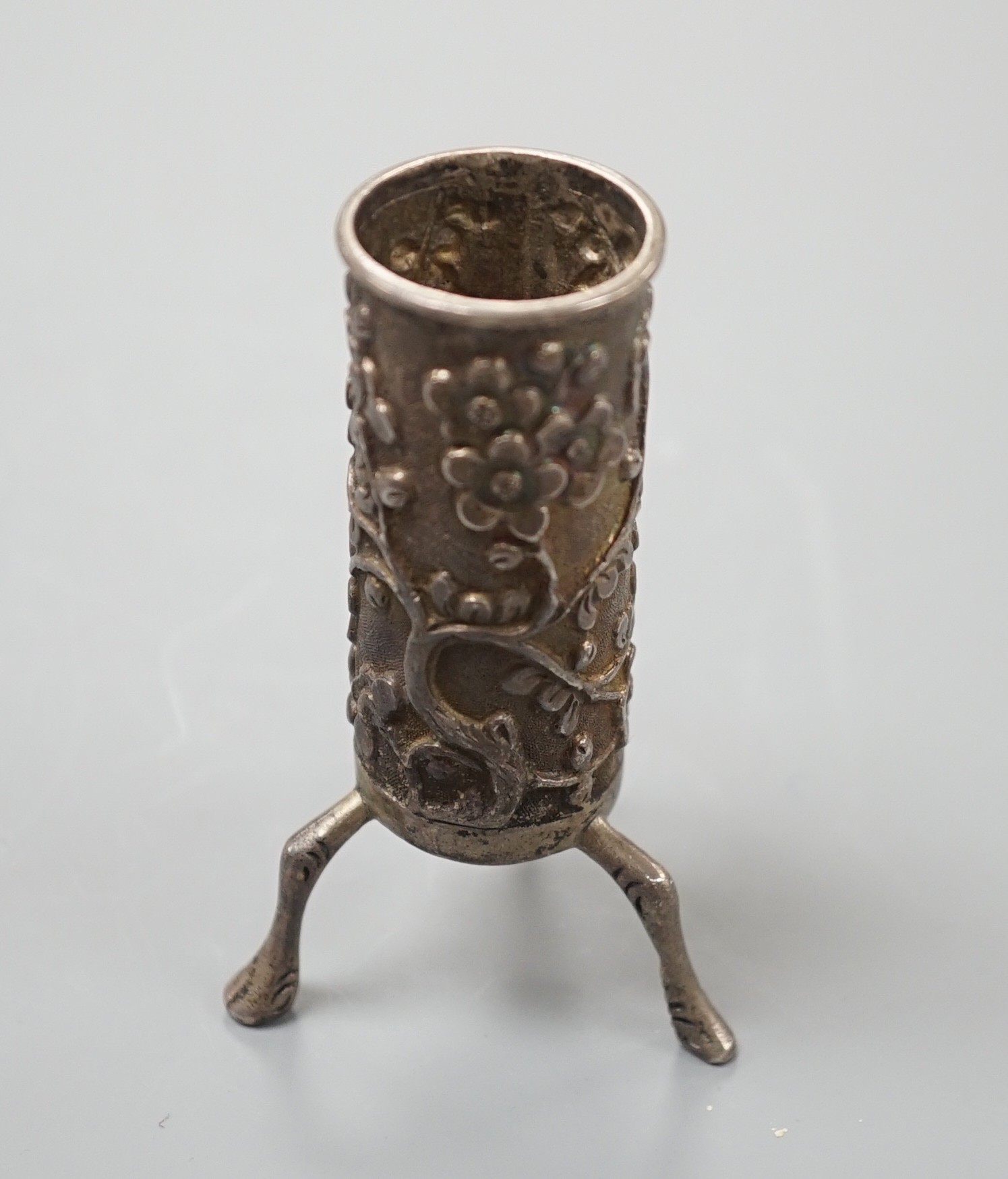A Chinese silver sleeve vase, by Wang Hing, 7 cms high.